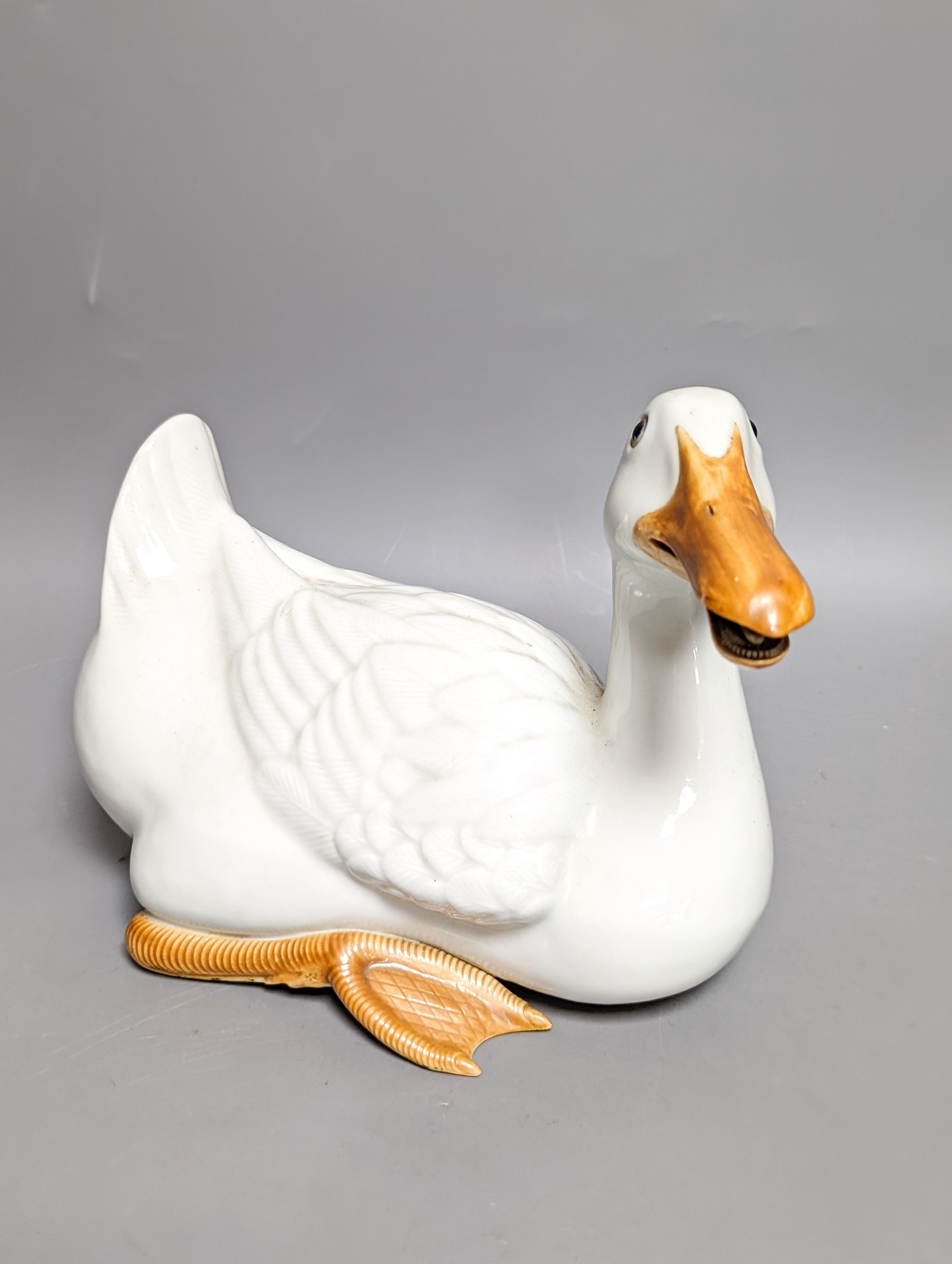 A modern painted decoy duck and a 20th century Chinese ceramic model duck (2) 42cm